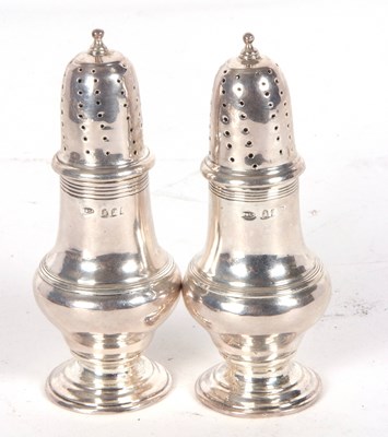 Lot 112 - Pair of silver casters of baluster form reeded...