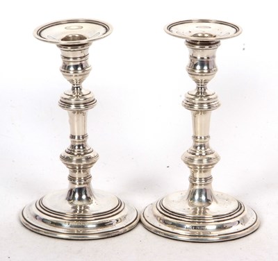 Lot 122 - A pair of Elizabeth II silver candlesticks in...