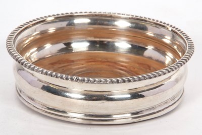 Lot 163 - A large silver plated bottle coaster with...