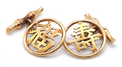 Lot 143 - A pair of 14k Chinese character cufflinks, the...