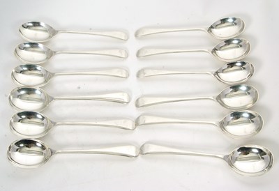 Lot 119 - Twelve Elizabeth II silver soup spoons, Old...