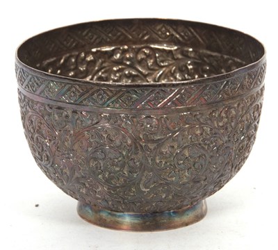 Lot 394 - An Eastern metal small bowl chased and...