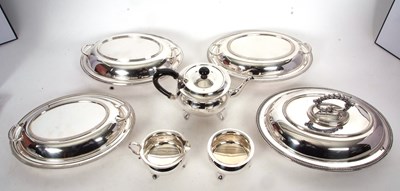 Lot 404 - Four silver plated entree dishes and covers,...