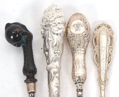 Lot 243 - Four late 19th/early 20th Century button hooks,...