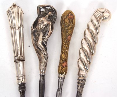 Lot 246 - Two silver and steel long handled button hooks,...