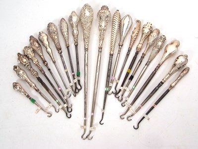 Lot 277 - Group of twenty silver and steel button hooks,...