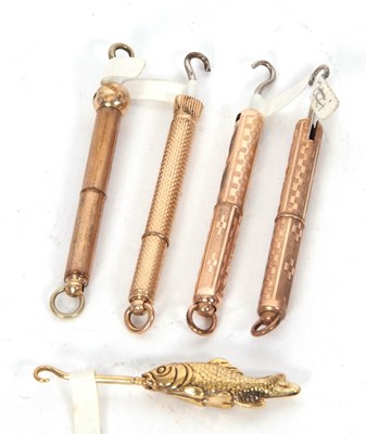 Lot 289 - Group of four antique gold plated retractable...