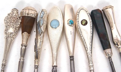 Lot 303 - Four silver and stone set long handled button...