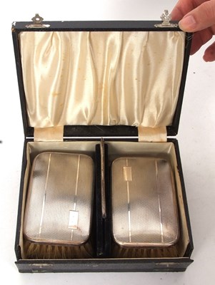 Lot 366 - Cased pair of George VI silver backed clothes...