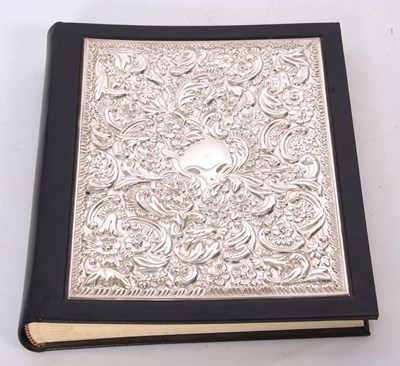 Lot 377 - Silver fronted and leather bound address book...