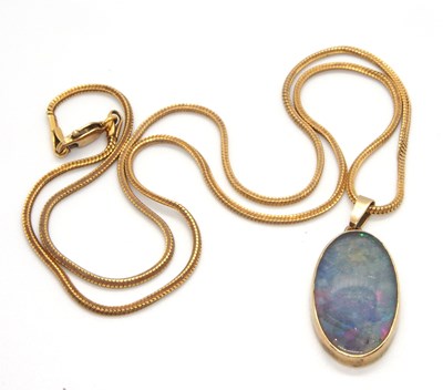 Lot 169 - An opal pendant and chain, the oval opal in...