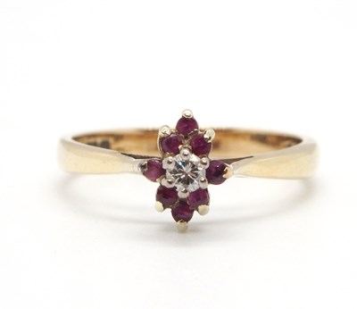 Lot 61 - A 9ct ruby and diamond cluster ring, the...