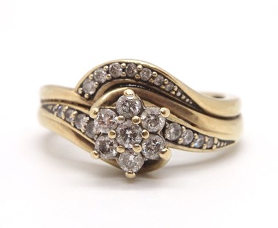 Lot 76 - A 9ct diamond crossover ring, set with a...