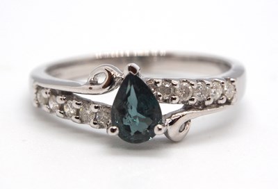 Lot 41 - An 18ct white gold diamond and blue-green...