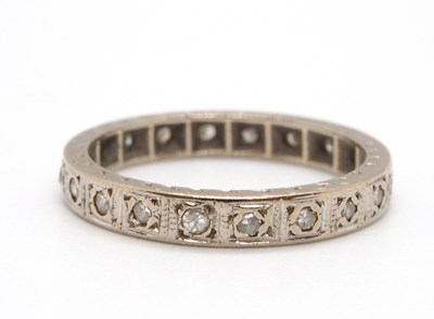 Lot 20 - A diamond eternity ring, set throughout with...