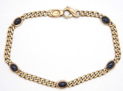 Lot 120 - A 9ct sapphire bracelet, the flat curblinks...