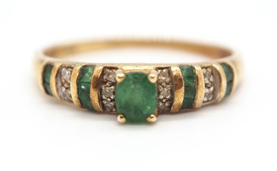 Lot 38 - A 14ct emerald and diamond ring, set to centre...