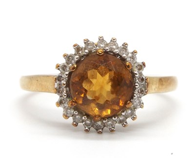 Lot 77 - A 9ct citrine and diamond ring, the round...