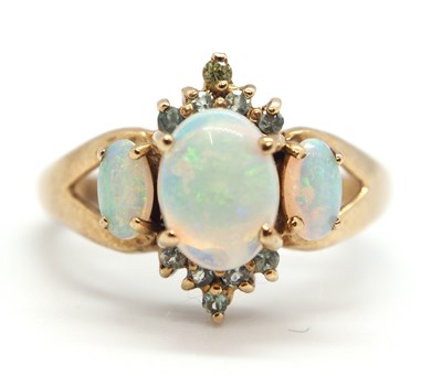 Lot 52 - A 9ct opal and pale green hardstone ring, the...