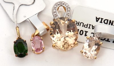 Lot 373 - Three 10K and one 9K gemset pendants: to...