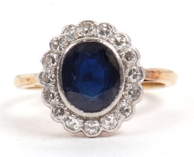 Lot 69 - An 18ct and platinum sapphire and diamond ring,...