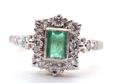 Lot 11 - An emerald and diamond ring, the central step...