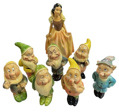 Lot 137 - Snow White and the Seven Dwarfs chalkware...