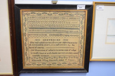 Lot 217 - A sampler silk/wool stitched on gauze,...