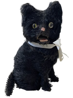 Lot 101 - A mohair clockwork cat with ribbon collar,...