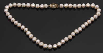 Lot 254 - A cultured pearl necklace, the off-round...