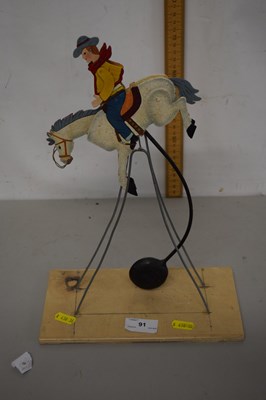 Lot 91 - Vintage gravity rocking cowboy and horse