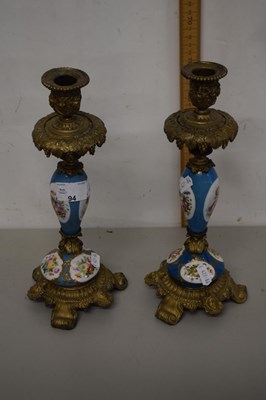 Lot 94 - A pair of porcelain mounted metal candlesticks