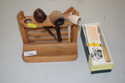 Lot 152 - A rack of vintage tobacco pipes