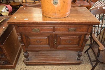 Lot 376 - Late Victorian oak two door, two drawer side...