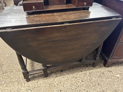 Lot 319 - 20th Century oak drop leaf dining table