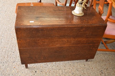 Lot 409 - A 19th Century oak drop leaf dining table