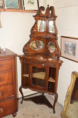 Lot 453 - A late Victorian American walnut mirror back...