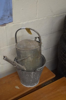 Lot 1033 - Galvanised watering can together with a...