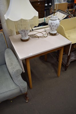 Lot 823 - A melomine covered drop leaf kitchen table