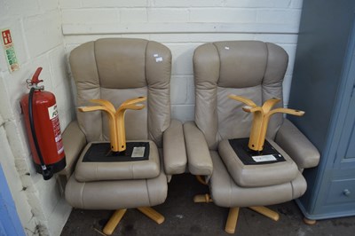 Lot 899 - A pair of recliner chairs and footstools