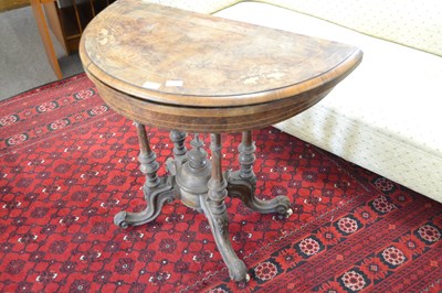 Lot 421 - A Victorian walnut veneered folding card table...