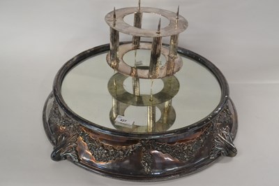 Lot 427 - A large silver plated mirrored cake stand of...