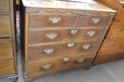 Lot 454 - A George III oak chest of two short over three...