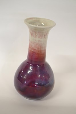 Lot 235 - A Ruskin vase with a flambe design, the base...