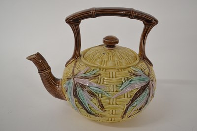 Lot 261 - A pottery teapot with Maiolica style glazes of...