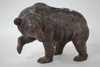 Lot 264 - A softwood carving of a bear in Black Forest...