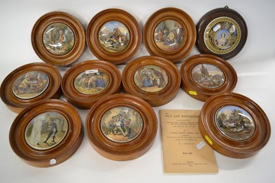 Lot 268 - A collection of pot lids, all in light oak frames