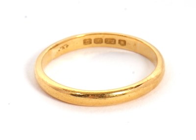 Lot 24 - A 22ct wedding band, hallmarked London 1953,...