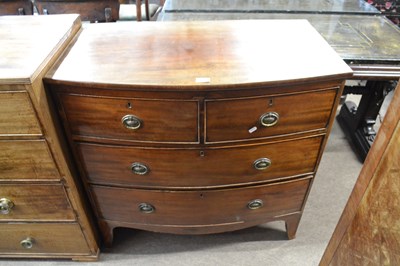 Lot 543 - Georgian mahogany bow front chest of two short...