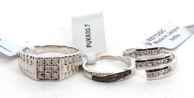 Lot 117 - Two silver and diamond rings and another ring:...